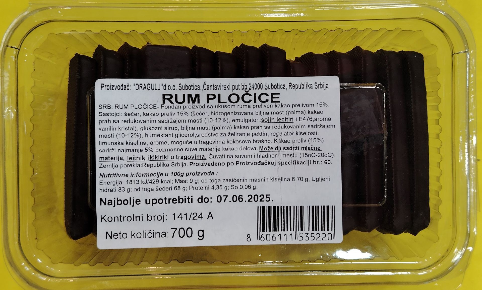 Packaged chocolate rum bars with an ingredient and nutritional information label in Serbian.