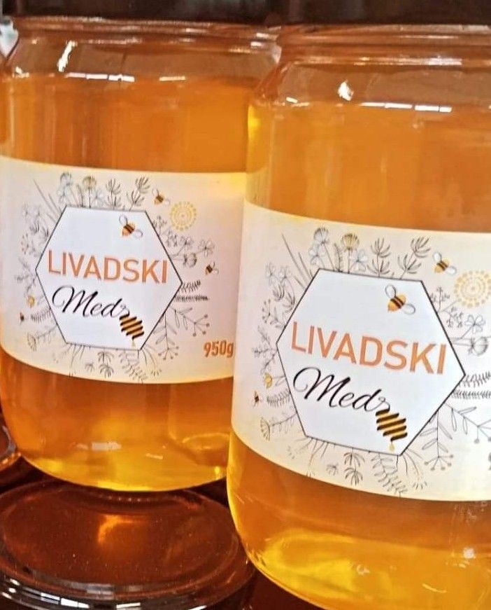 Two jars of Livadski Med honey with a floral design label and golden honey inside.